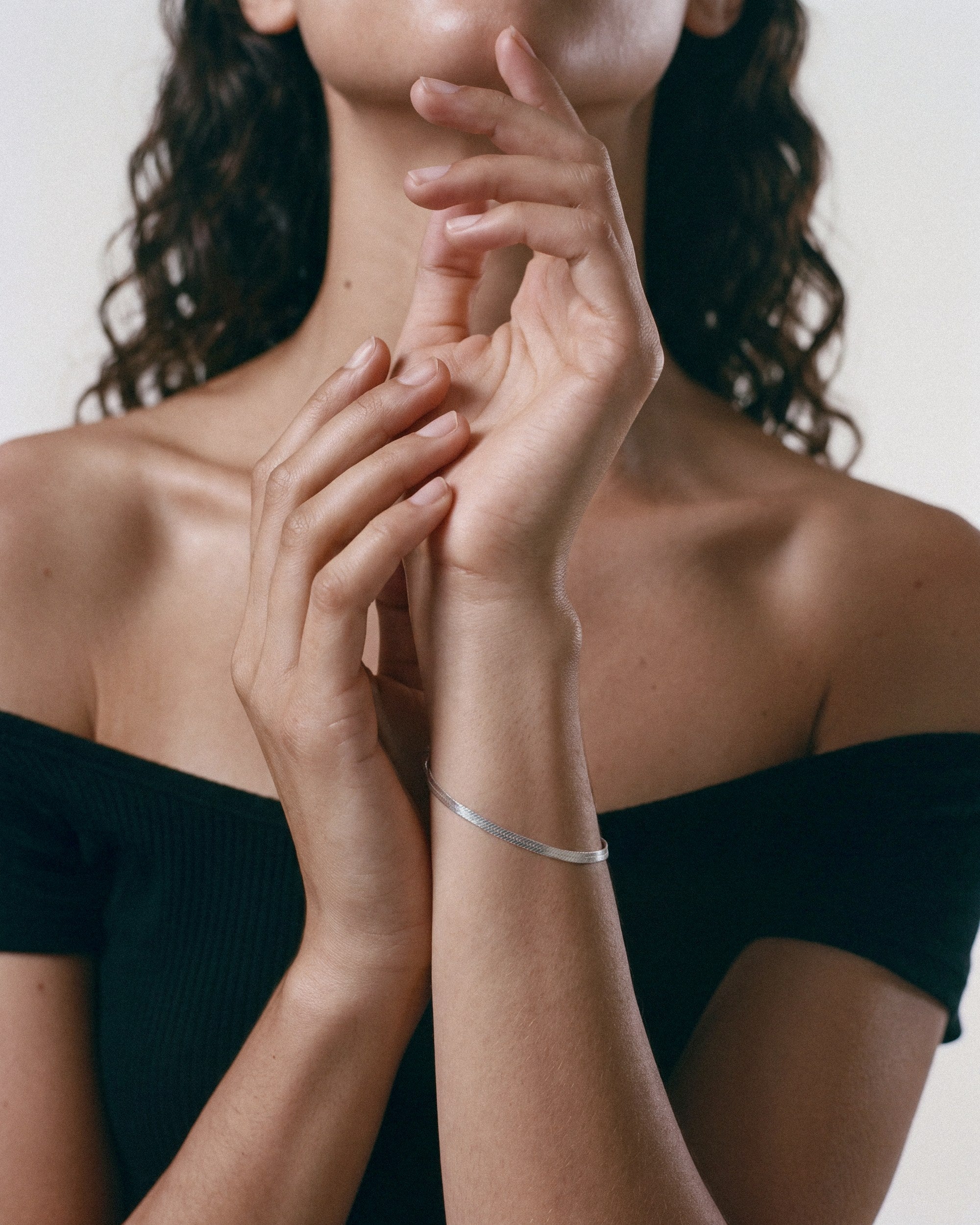 Baixa Alexa Bracelet in silver, worn by a model — close-up, for COLD SKIN.