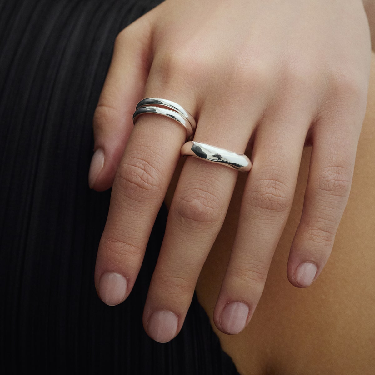 Close-up of hands wearing Arishi Basic Big and Small Ring for COLD SKIN.