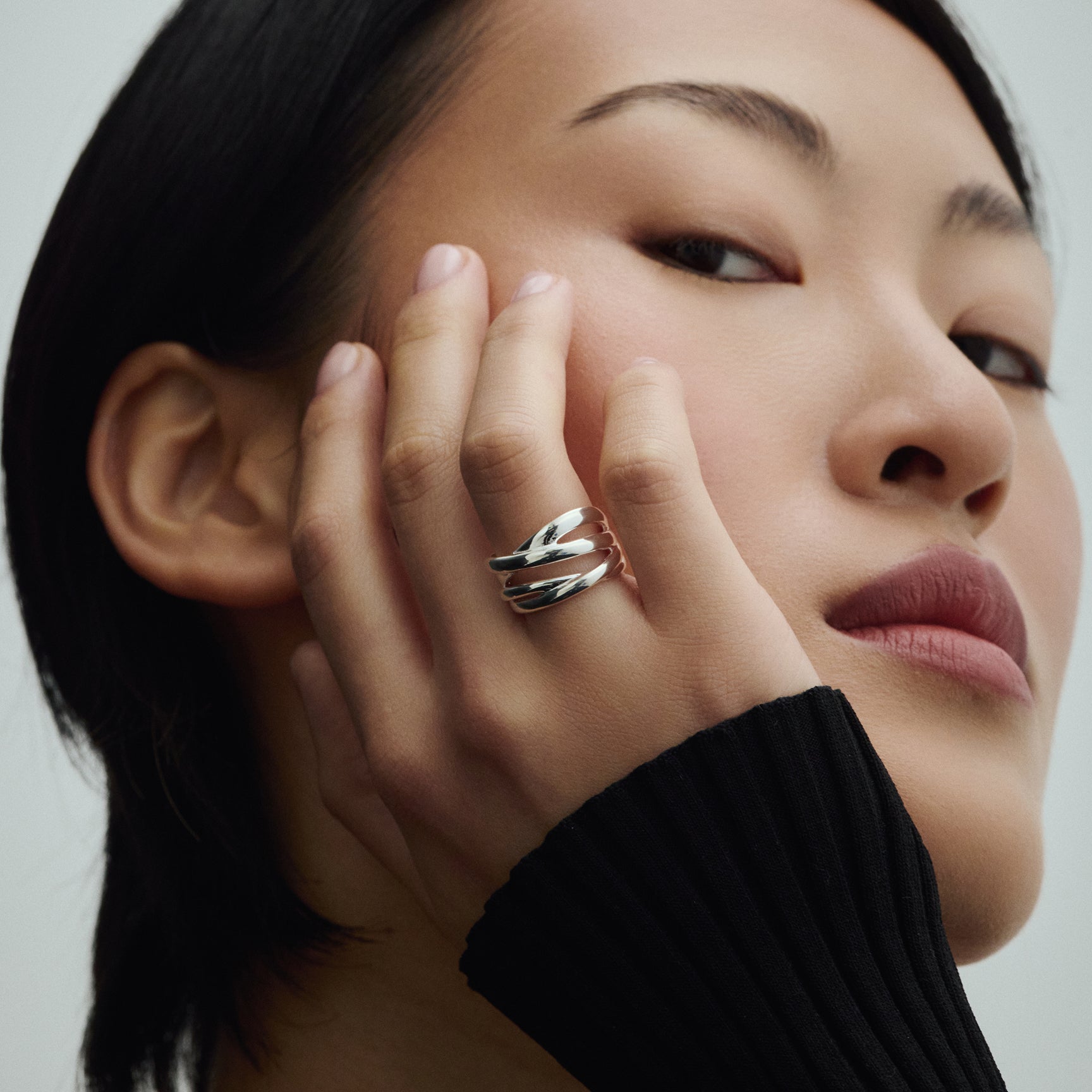 Close-up of a model wearing the BAIXA Lucia Ring in silver, photographed for COLD SKIN