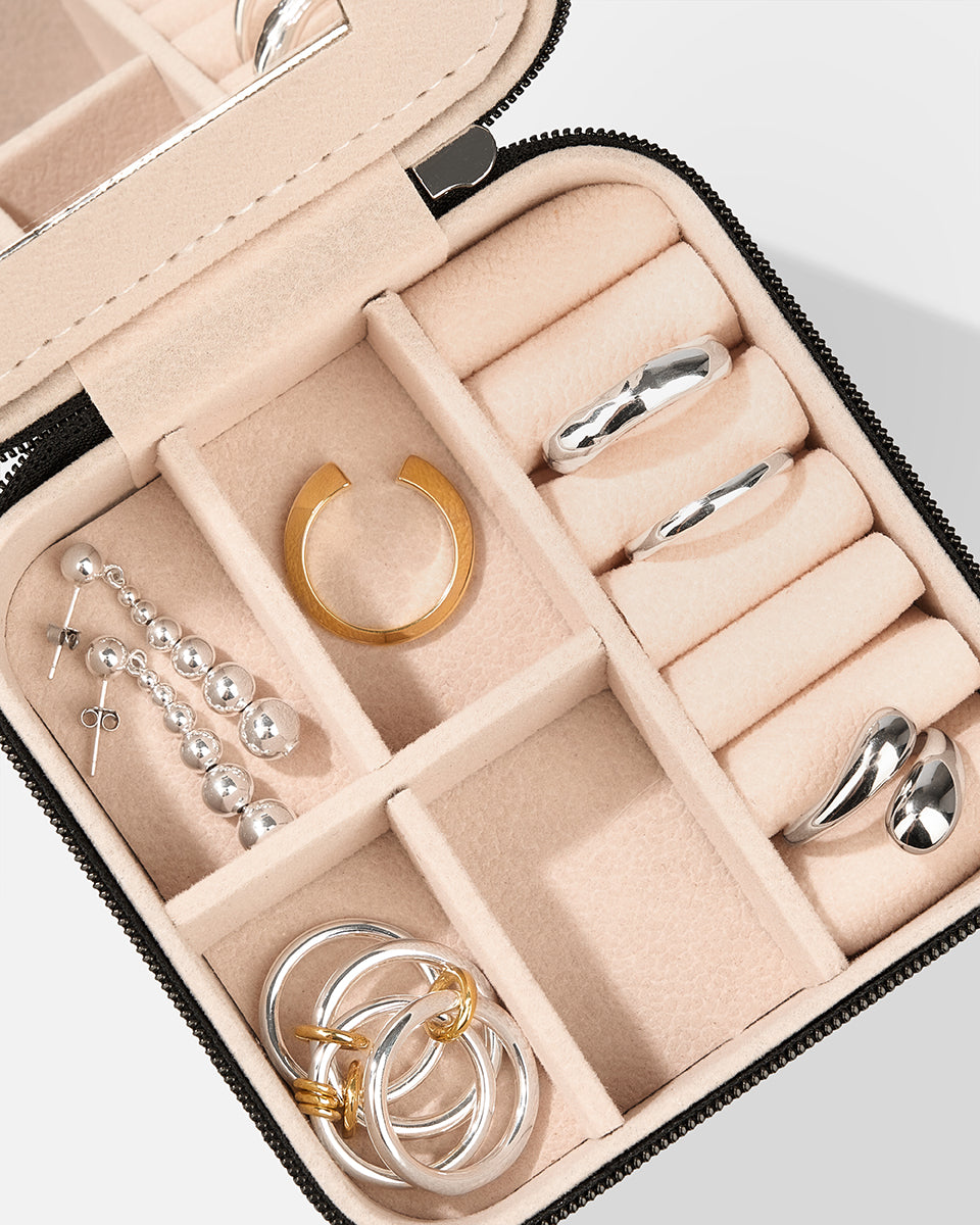 Close-up of Jewelry Travel Box Black by COLD SKIN with organized jewelry compartments