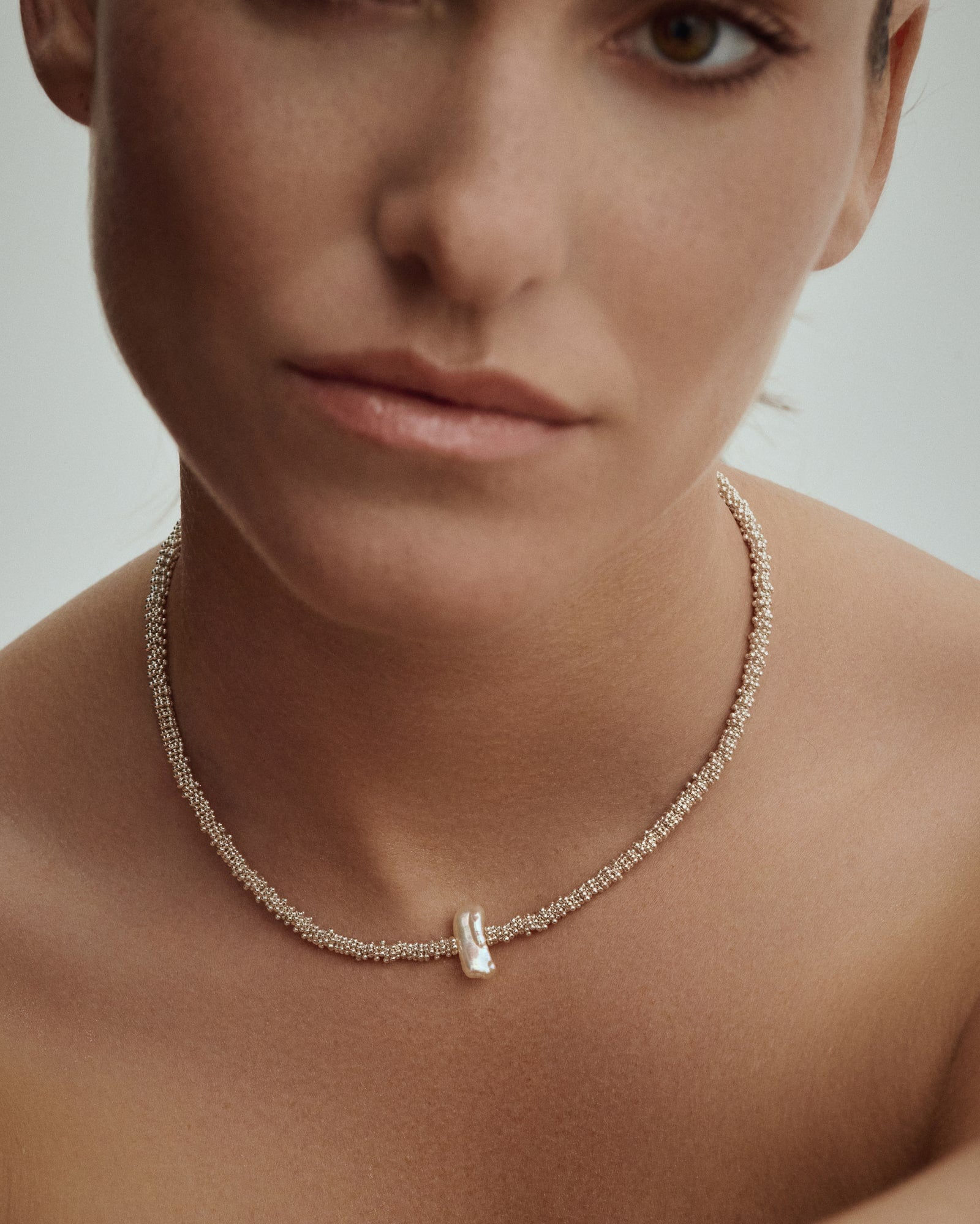 Model wearing Pearl Naked Reef Pearl Choker