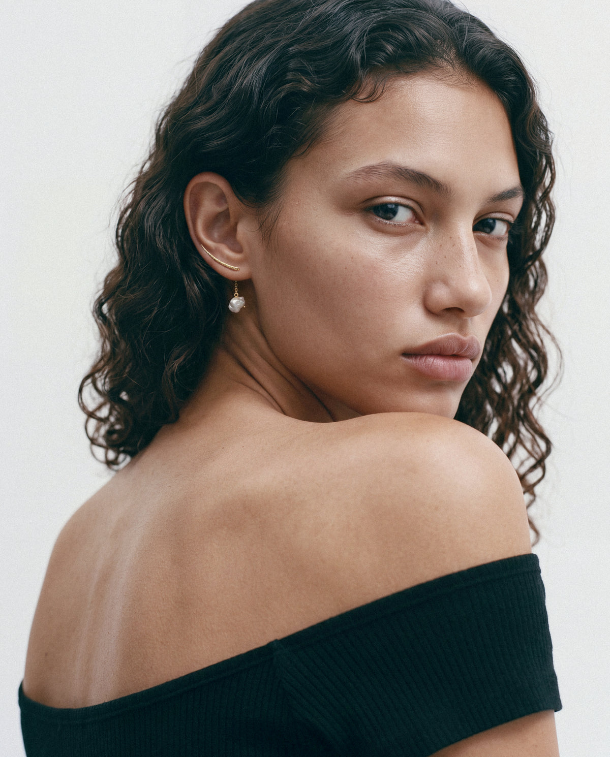 Model wearing the Sumbawa Ear Cuff - Gold