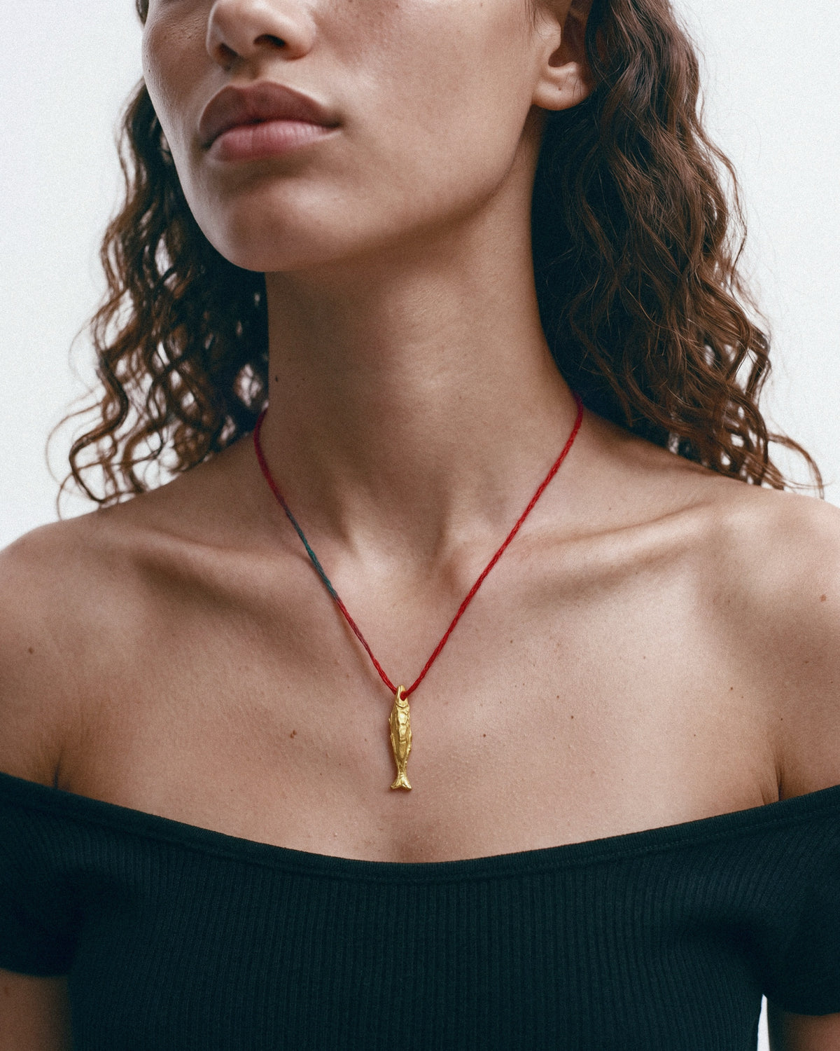ÉCLIS Oona Amulet in Gold, worn by a model – close-up, for COLD SKIN.
