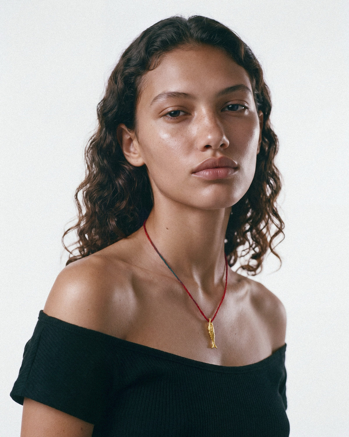 ÉCLIS Oona Amulet in Gold, worn by a model, for COLD SKIN.