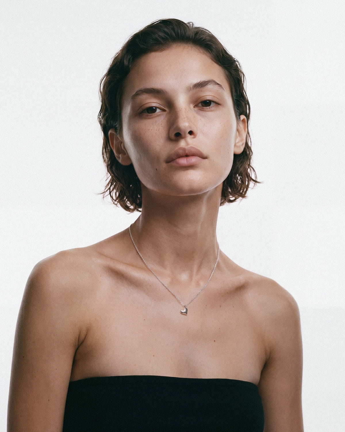 ARISHI Heart Necklace in Silver, worn by a model, for COLD SKIN.