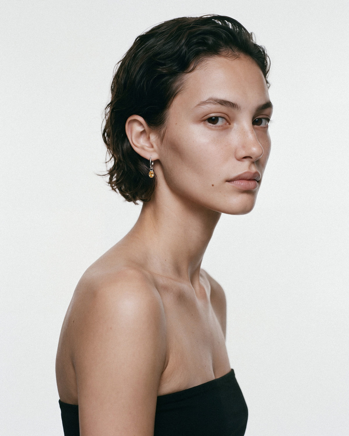 ARISHI Ideal Hoops Earrings in Silver & Yellow, worn by a model, for COLD SKIN.