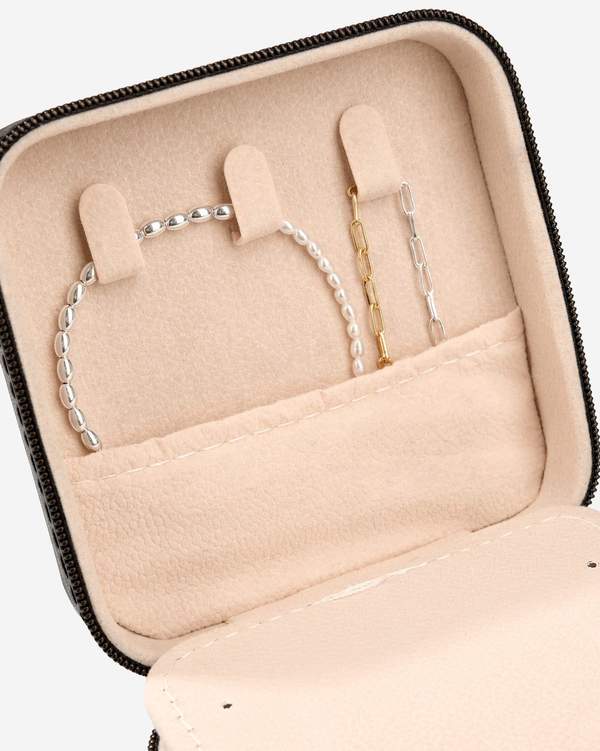 Close-up of Jewelry Travel Box Black by COLD SKIN with necklace holders and inner pocket