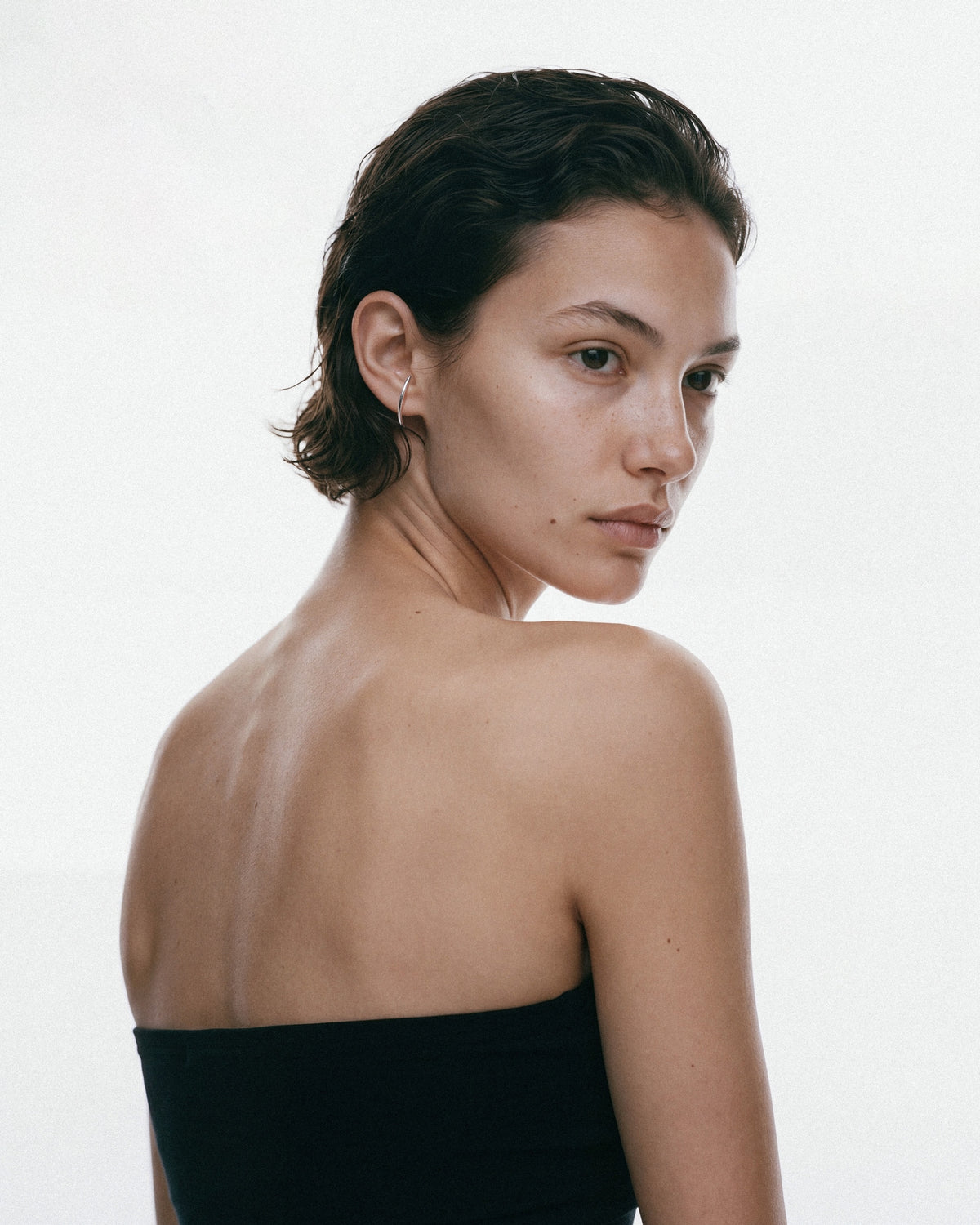 NO MORE Radius Earrings in Silver, worn by a model, for COLD SKIN.