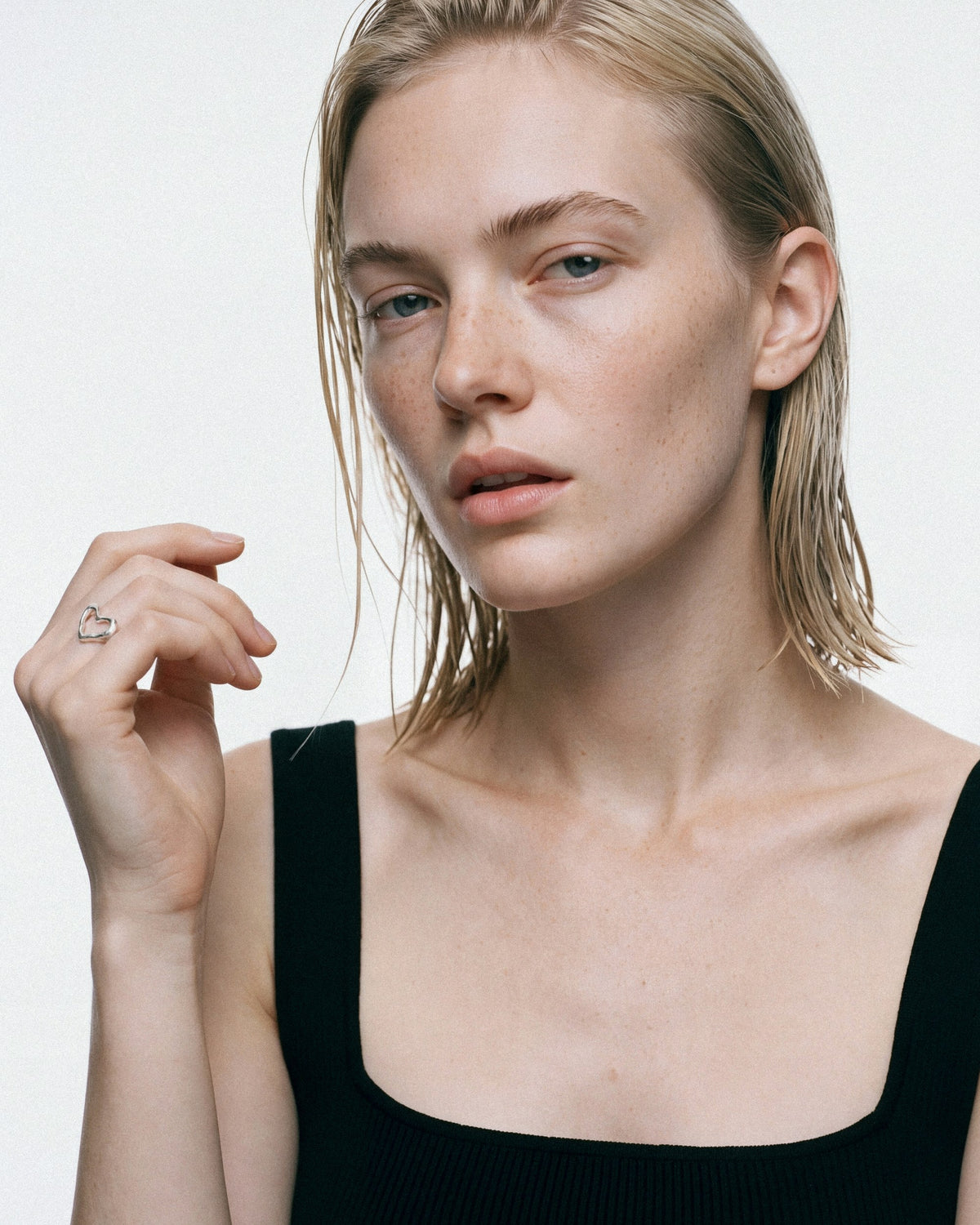 Arishi Open Heart Ring in silver, worn by a model, for COLD SKIN.