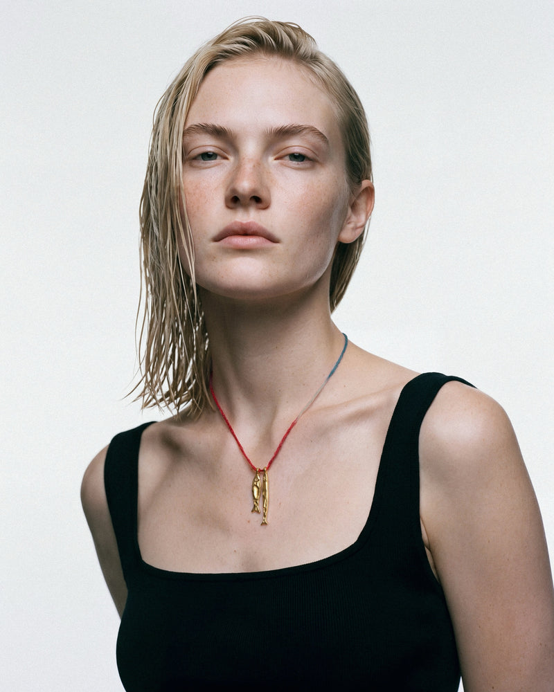ÉCLIS Asho Amulet in Gold, worn by a model, for COLD SKIN.