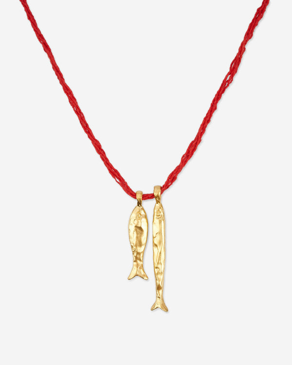 Close-up of Éclis Asho Fish Amulet in gold