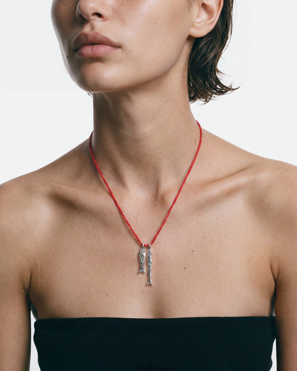 Éclis Asho Amulet in silver, worn by a model — close-up, for COLD SKIN.
