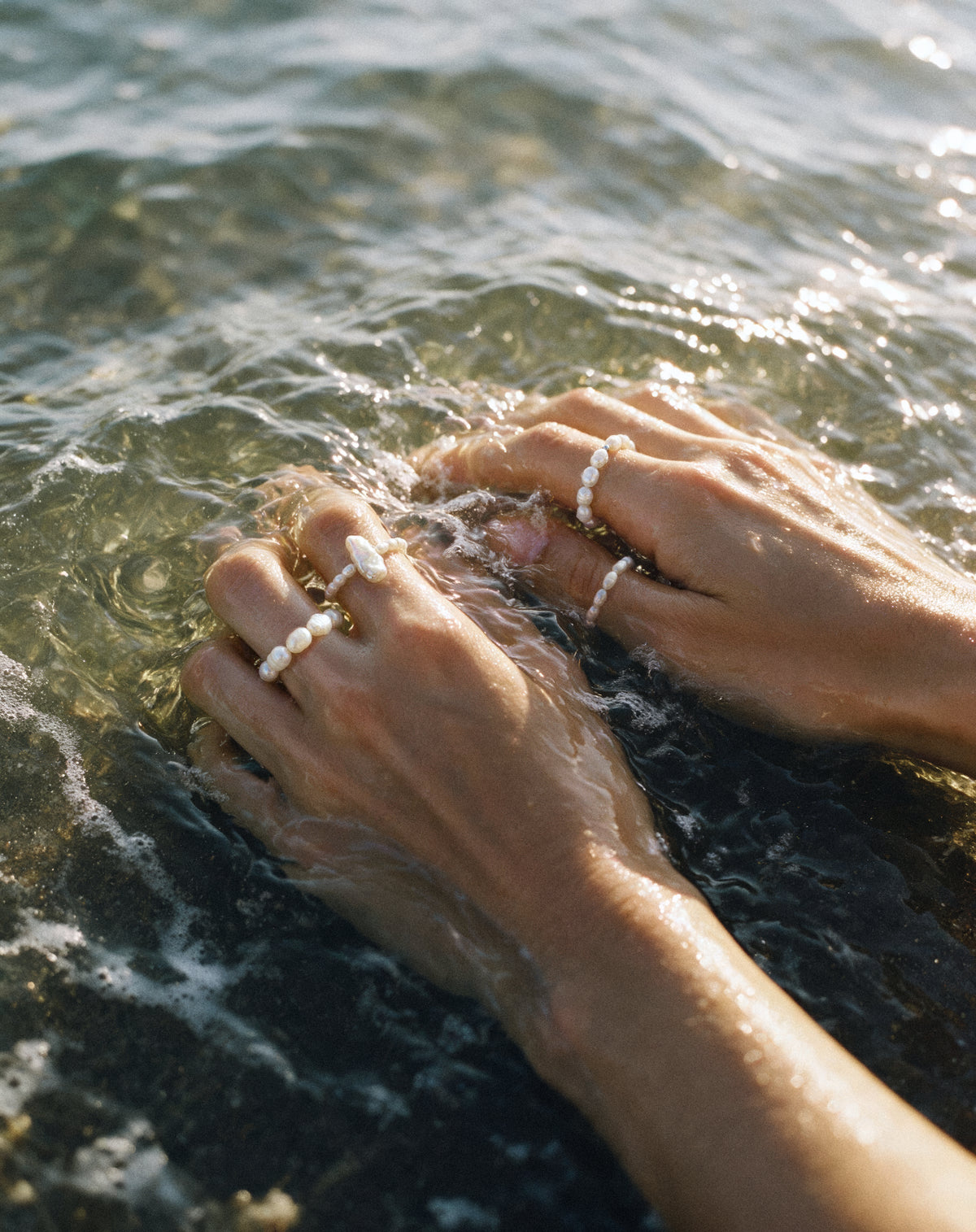 Close-up of the Pearl Naked Big Rice, Rice and August Ring under the water, photographed for COLD SKIN