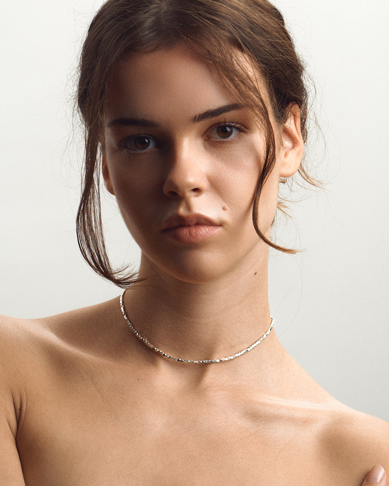Model wearing Pearl Naked Cubes Choker.