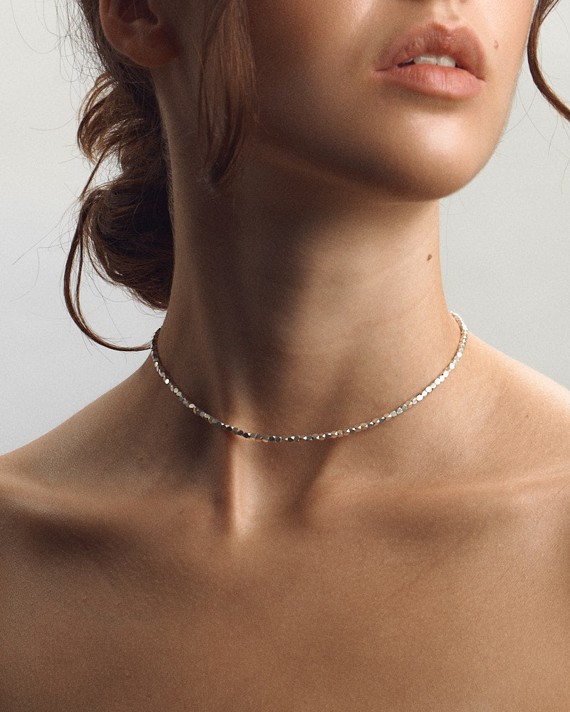 Model wearing Pearl Naked Cubes Choker.