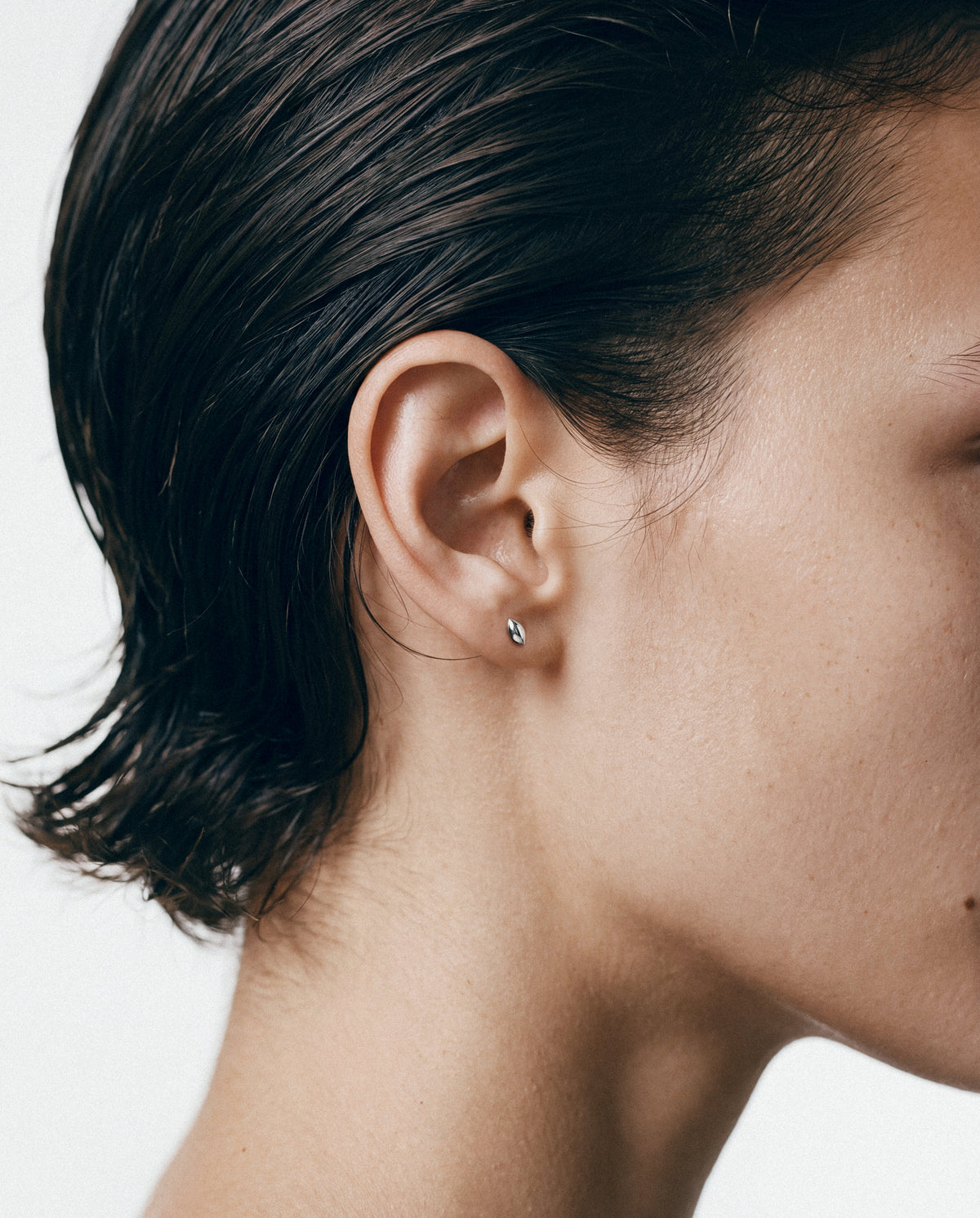 Close-up of the Anchor Stud - Silver, worn