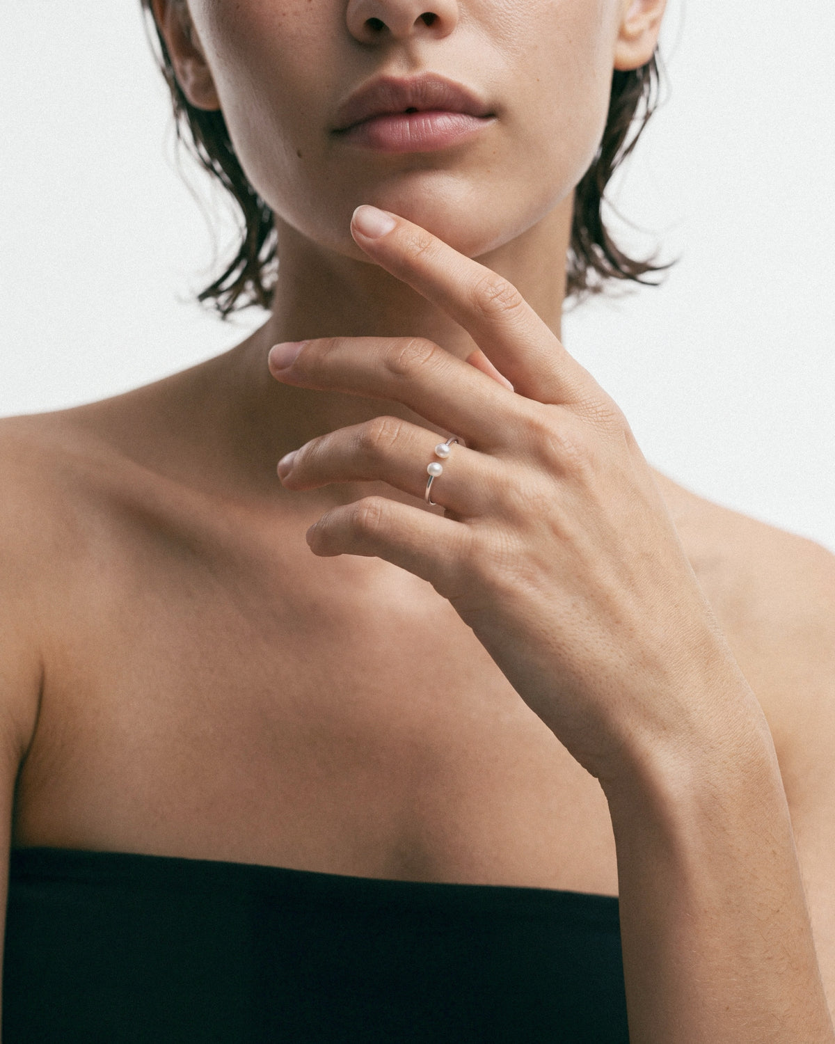 PEARL NAKED Crab Eye Ring in Silver & White, worn by a model – close-up, for COLD SKIN.