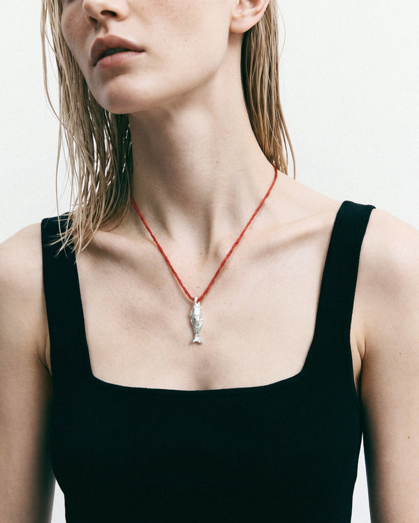 Éclis Oona Amulet in silver, worn by a model — close-up, for COLD SKIN.