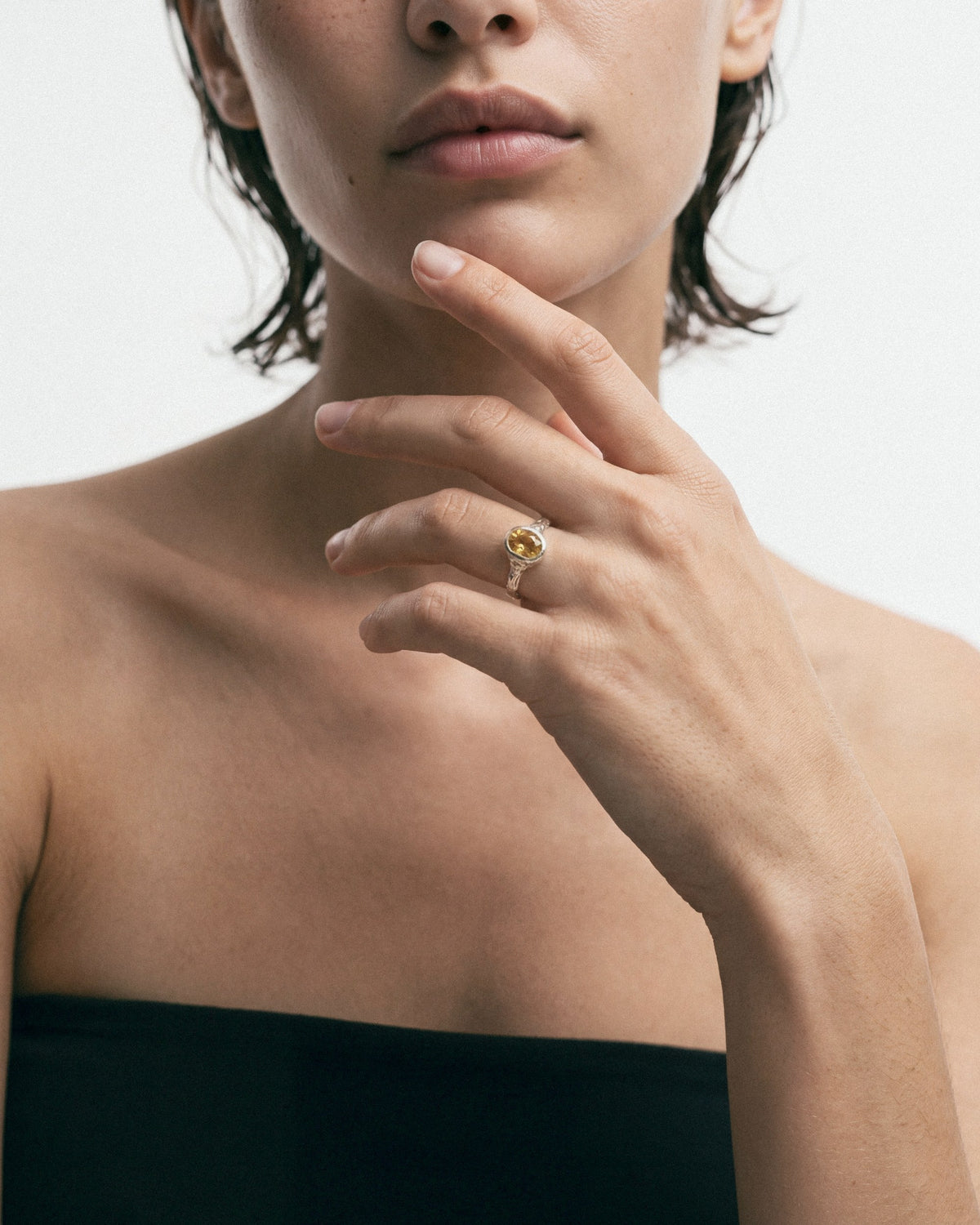 Arishi Elf Ring in silver with citrine, worn by a model — close-up, for COLD SKIN.