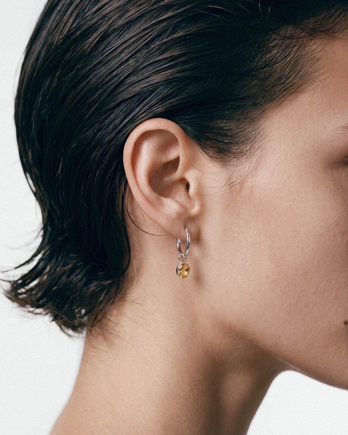 ARISHI Ideal Hoops Earrings in Silver & Yellow, worn by a model – close-up, for COLD SKIN.