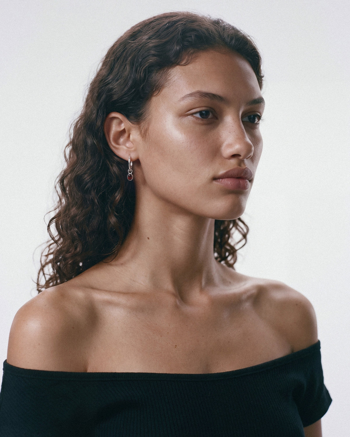 ARISHI Ideal Hoops Earrings in Silver & Red, worn by a model, for COLD SKIN.