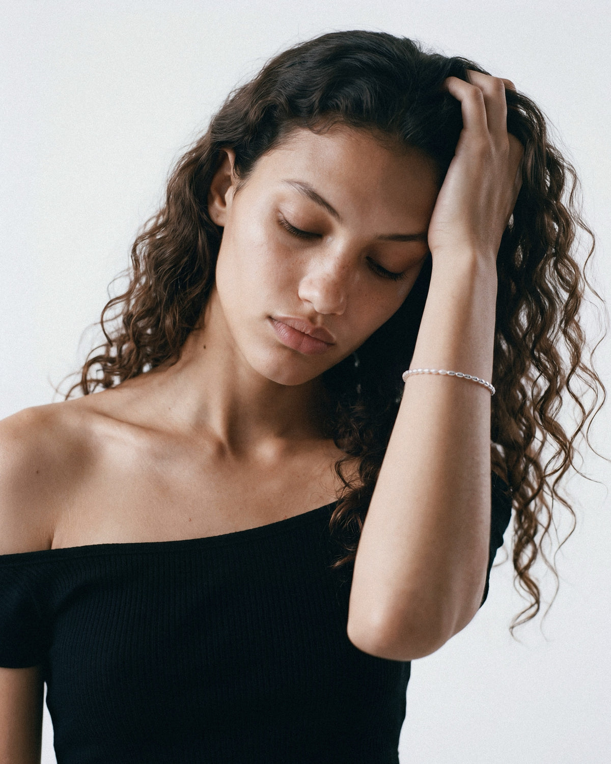 PEARL NAKED Lola Bracelet in Silver & White, worn by a model, for COLD SKIN.