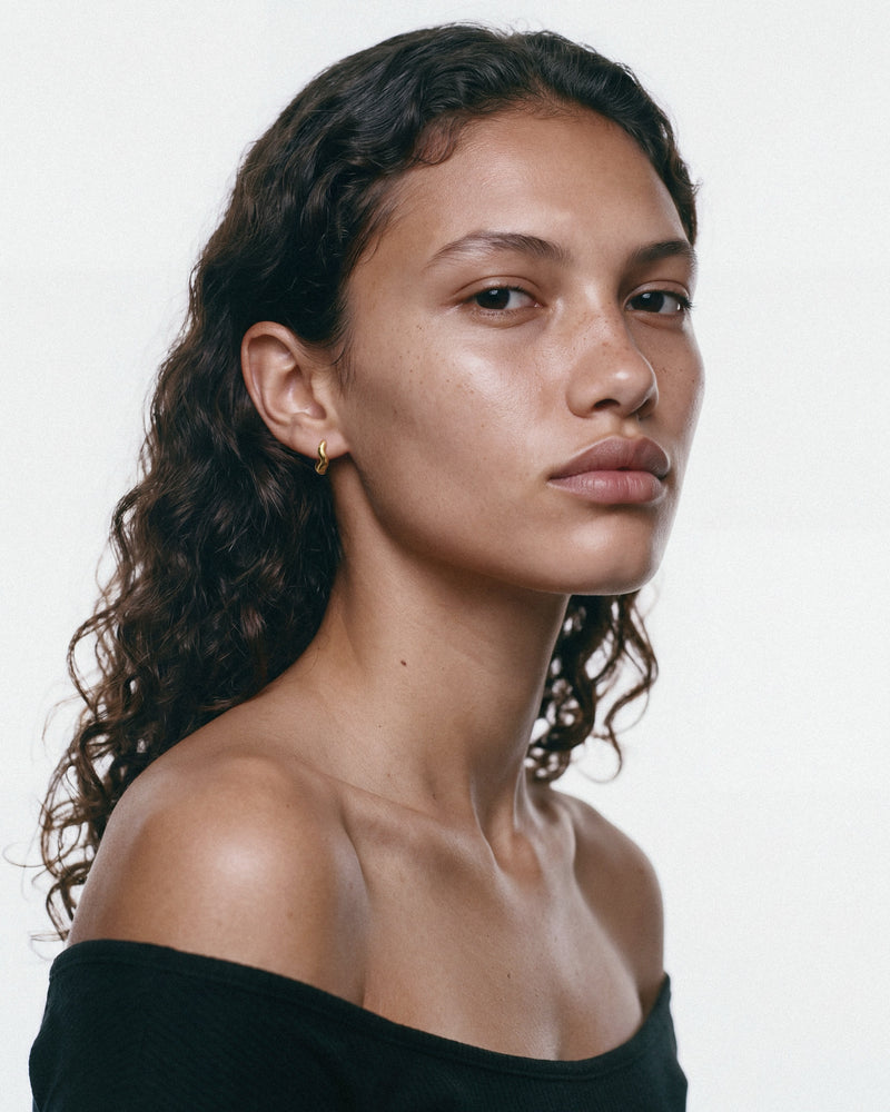 Louis Abel Aurea Polished Mini Hoop in Gold, worn by a model, for COLD SKIN.