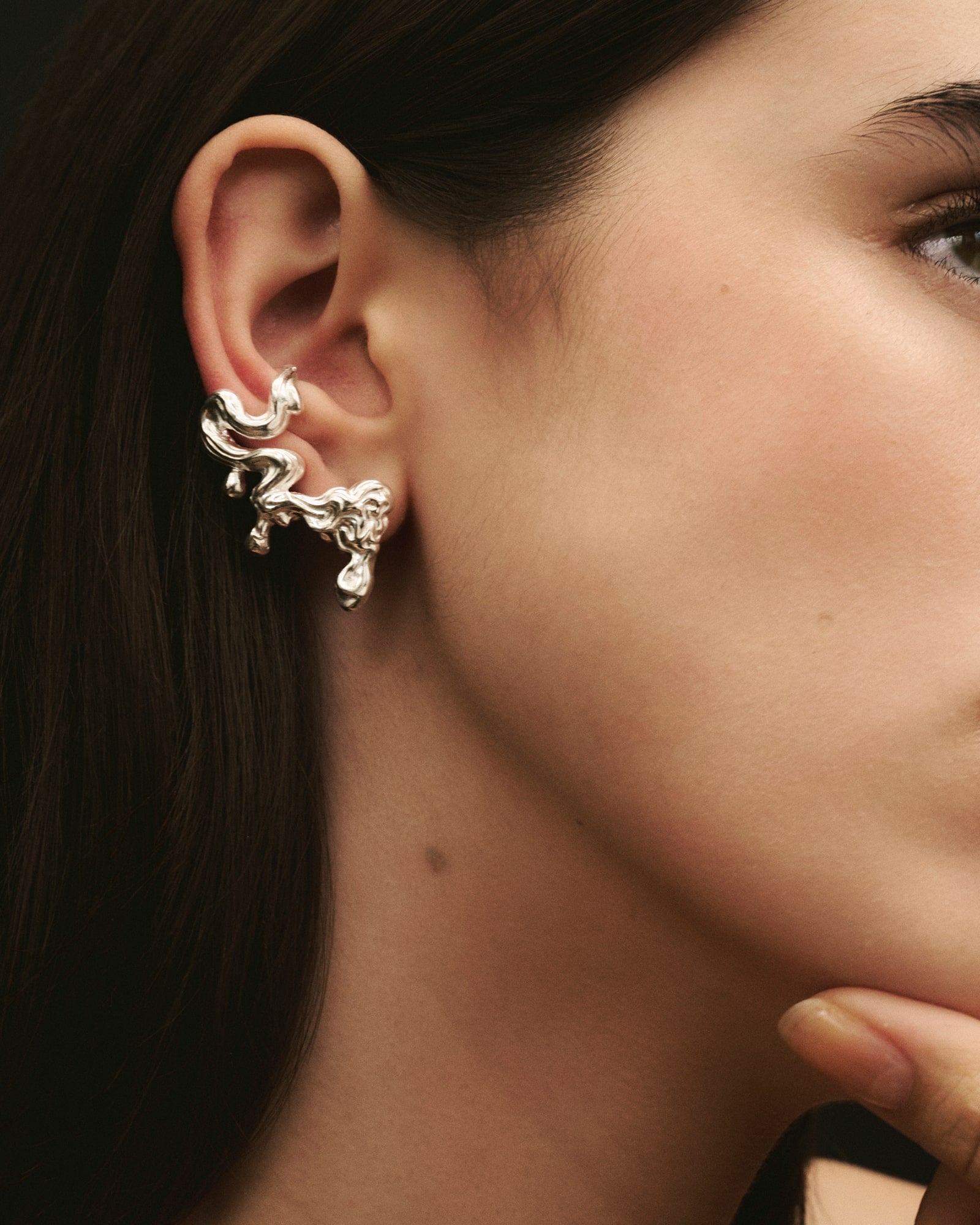 Close-up of women wearing Louis Abel Umor Ear Climber in silver.