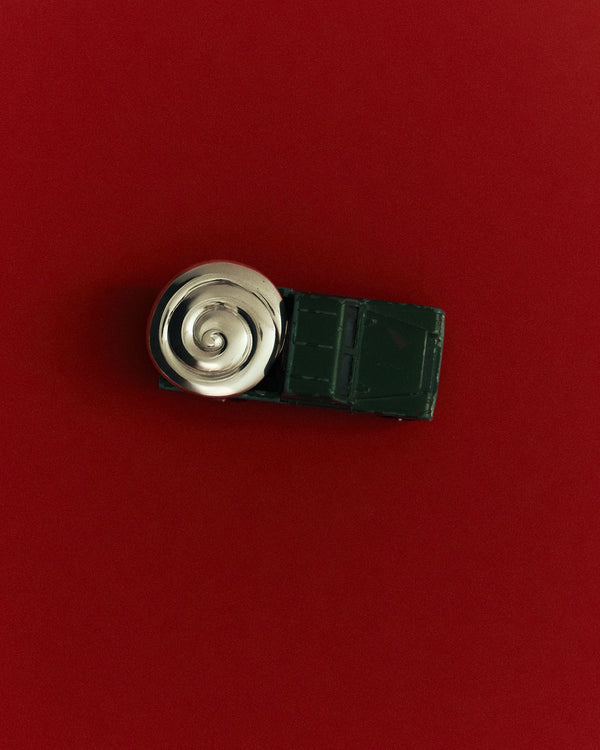 Louis Abel Uzu Mid Earrings in silver on a red background.