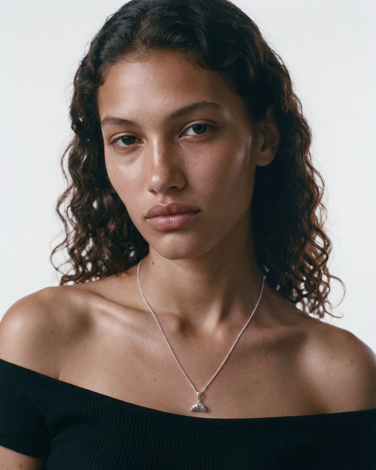 NO MORE Croissant Necklace in Silver, worn by a model, for COLD SKIN.