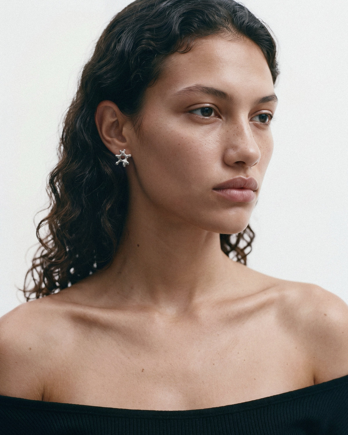 NO MORE Sea Flower Earrings in Silver, worn by a model, for COLD SKIN.