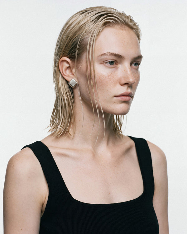 NO MORE The Icon Earrings in Silver, worn by a model, for COLD SKIN.