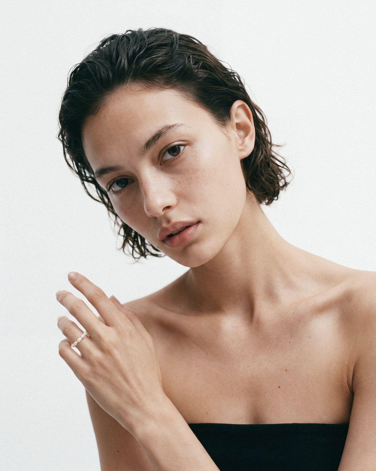PEARL NAKED Rice Hand Ring in White, worn by a model, for COLD SKIN.
