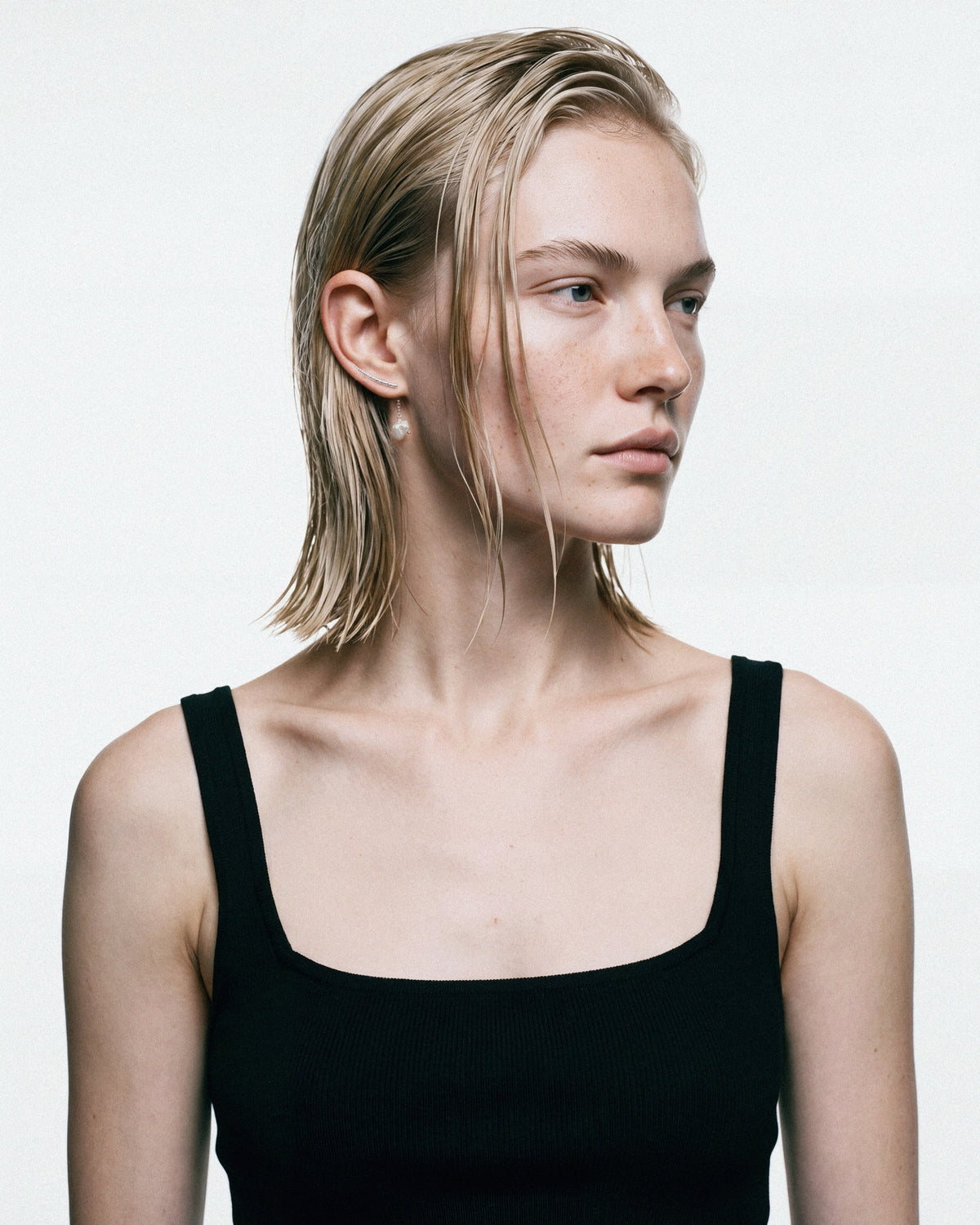 SEASTER Sumbawa Ear Cuff in Silver & White, worn by a model, for COLD SKIN.